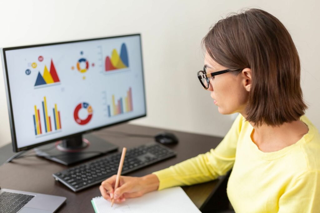 woman looking at a computer