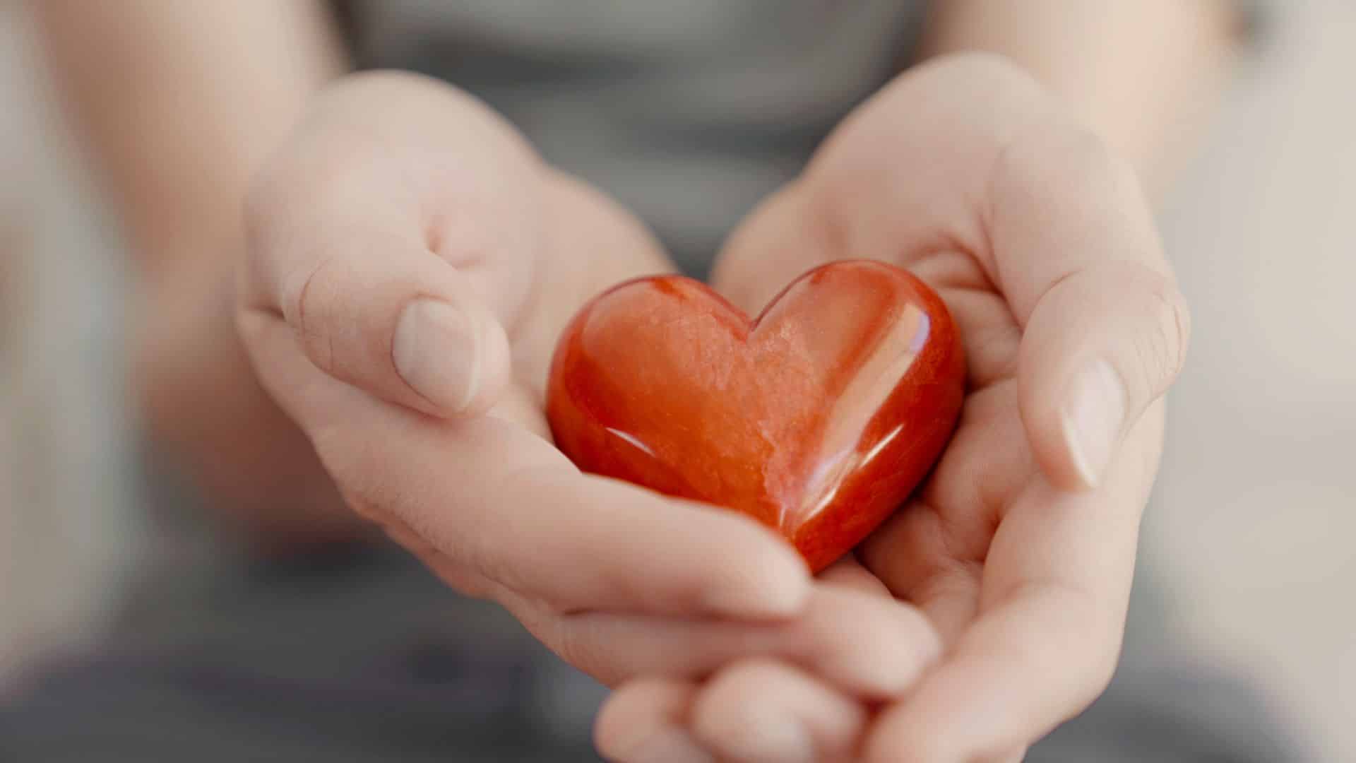 hands holding red heart