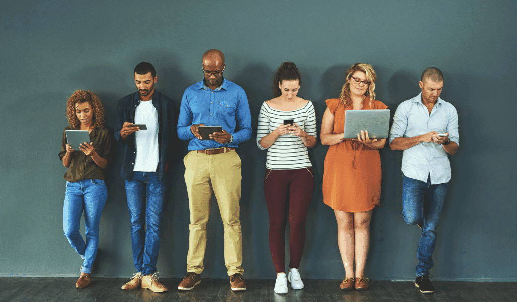group of people looking at their digital devices