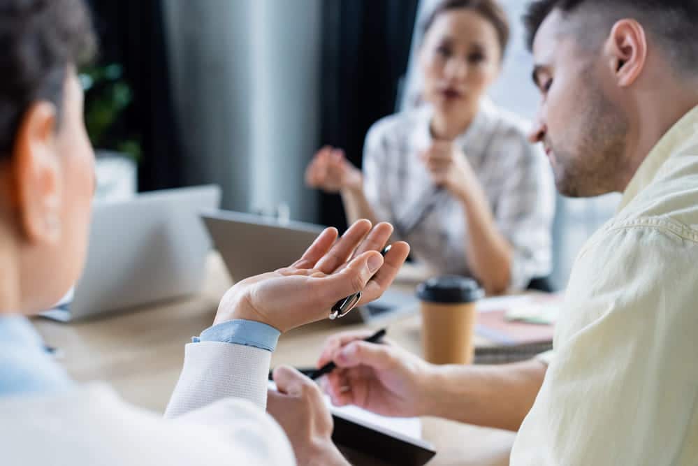 group of people having a meeting at a conference table